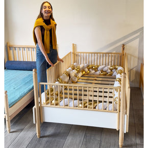 cama con barandales de madera